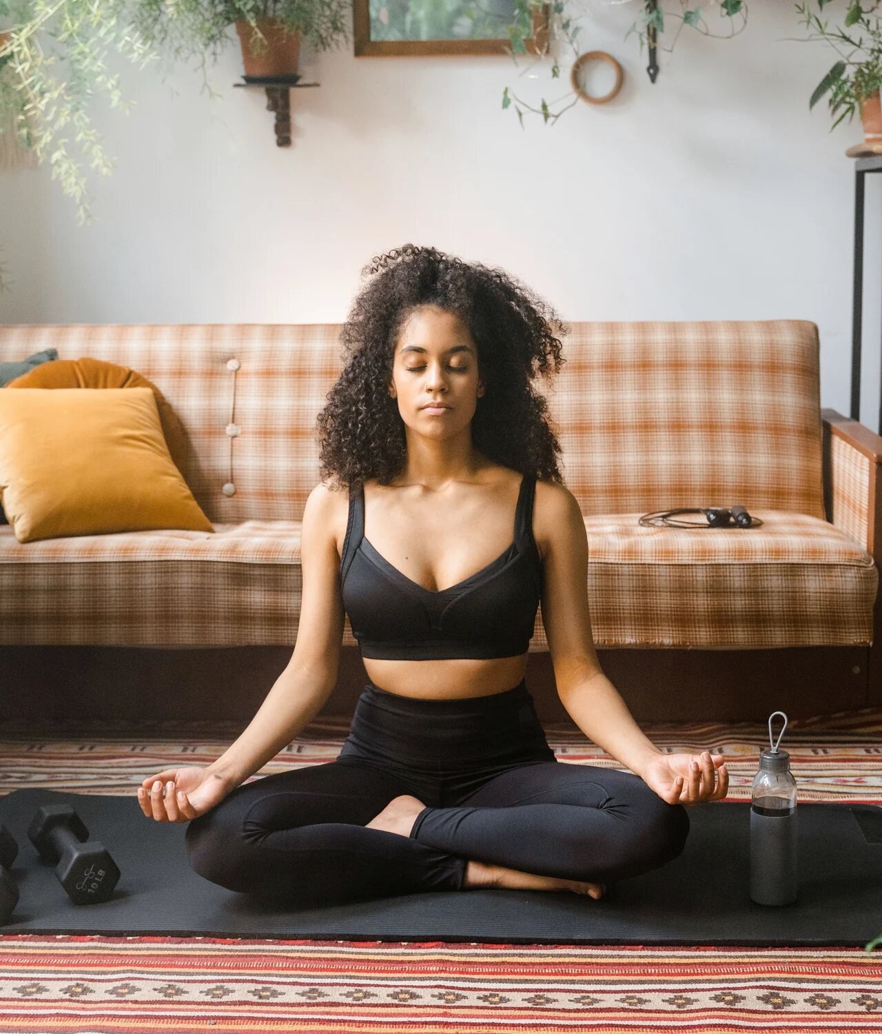 Woman practising meditation in a calm natural setting